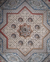 red white and black floral textile