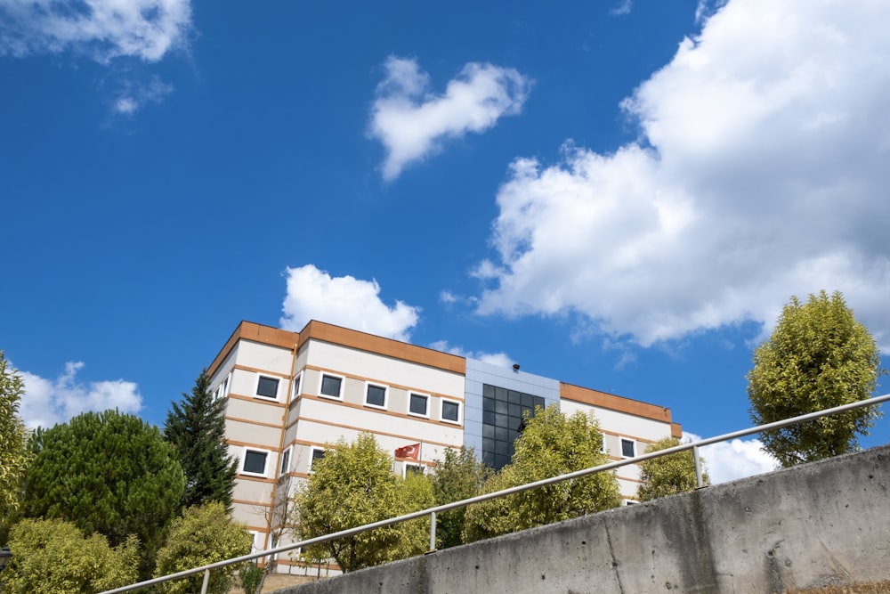 white and brown concrete building under blue sky during daytime