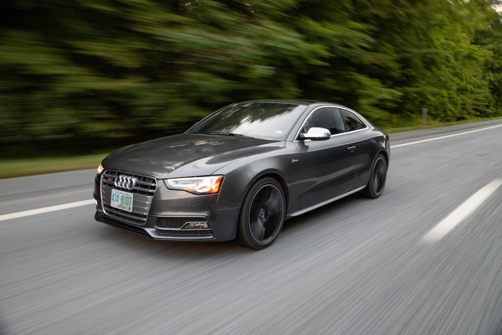 black audi coupe on road during daytime