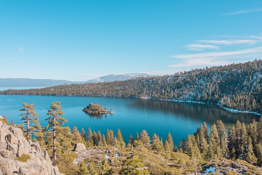blue lake surrounded by green trees under blue sky during daytime in Emerald Bay State Park United States