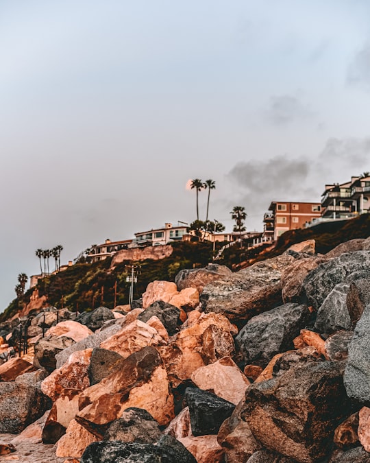 brown and gray concrete building under gray sky in Laguna Beach United States