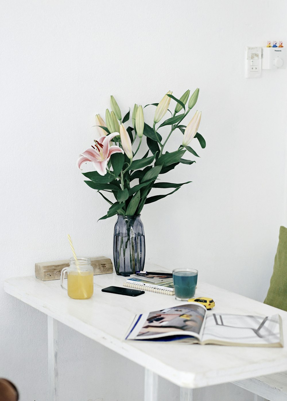 pink and green flower bouquet on table