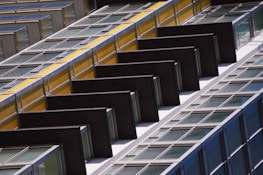 Completed modern building facade with black and yellow design elements reflecting Selif Yapı's brand colors.