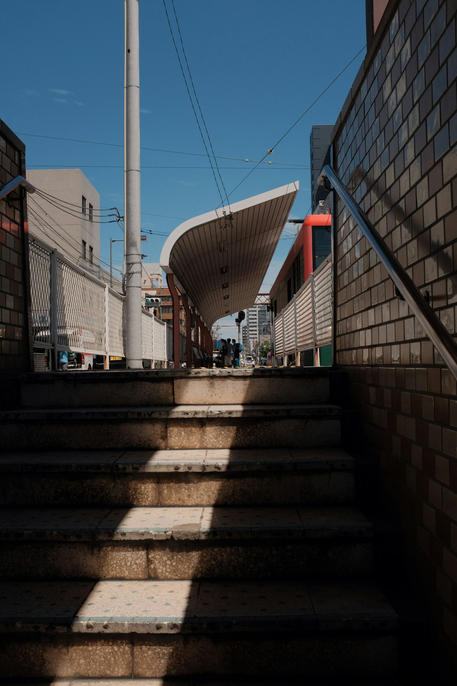 Fujifilm X100F sample photo. Gray concrete stairs with photography