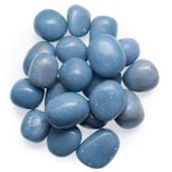 Smooth tumble stones in various shades of blue and green displayed on white fabric.