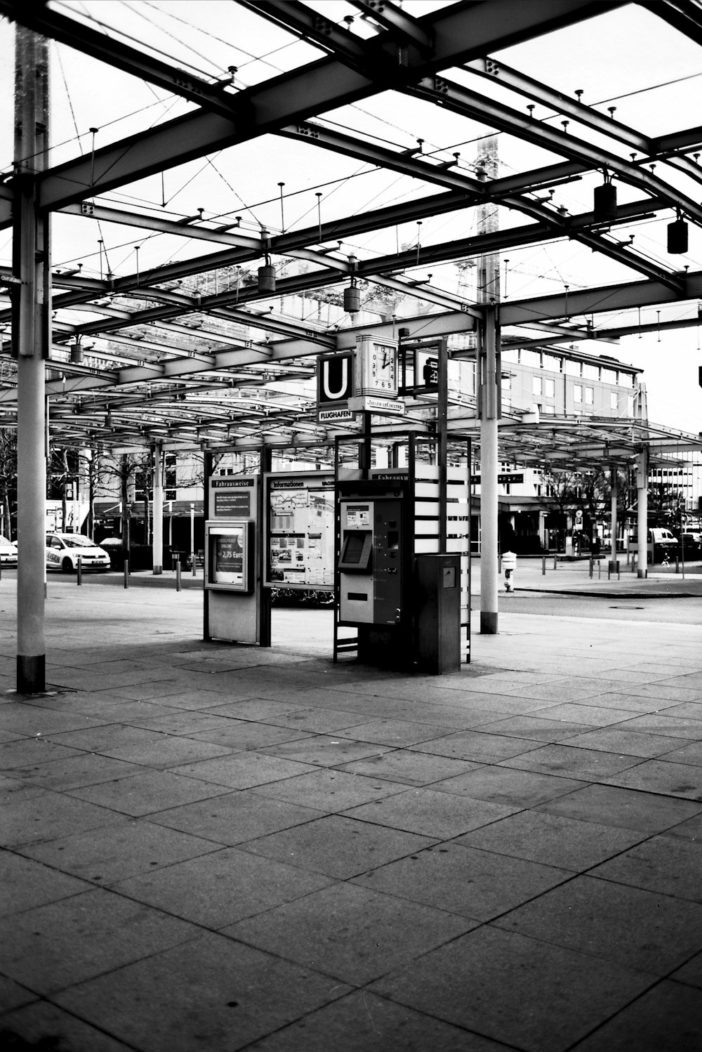 grayscale photo of waiting shed