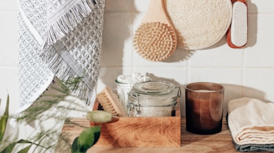 brown wooden chopping board beside clear glass jar