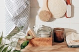 brown wooden chopping board beside clear glass jar