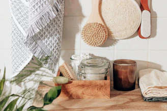brown wooden chopping board beside clear glass jar