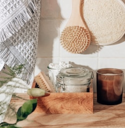 brown wooden chopping board beside clear glass jar