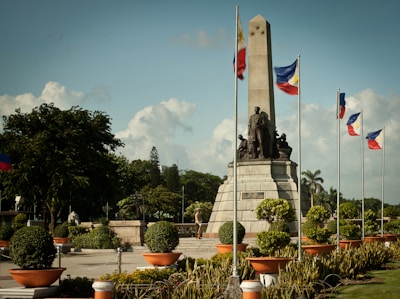 statue of man holding flag