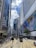 people walking on pedestrian lane near high rise buildings during daytime