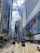 people walking on pedestrian lane near high rise buildings during daytime