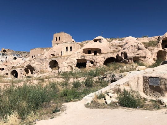 brown rock formation under blue sky during daytime in Göreme Tarihi Milli Parkı Turkey