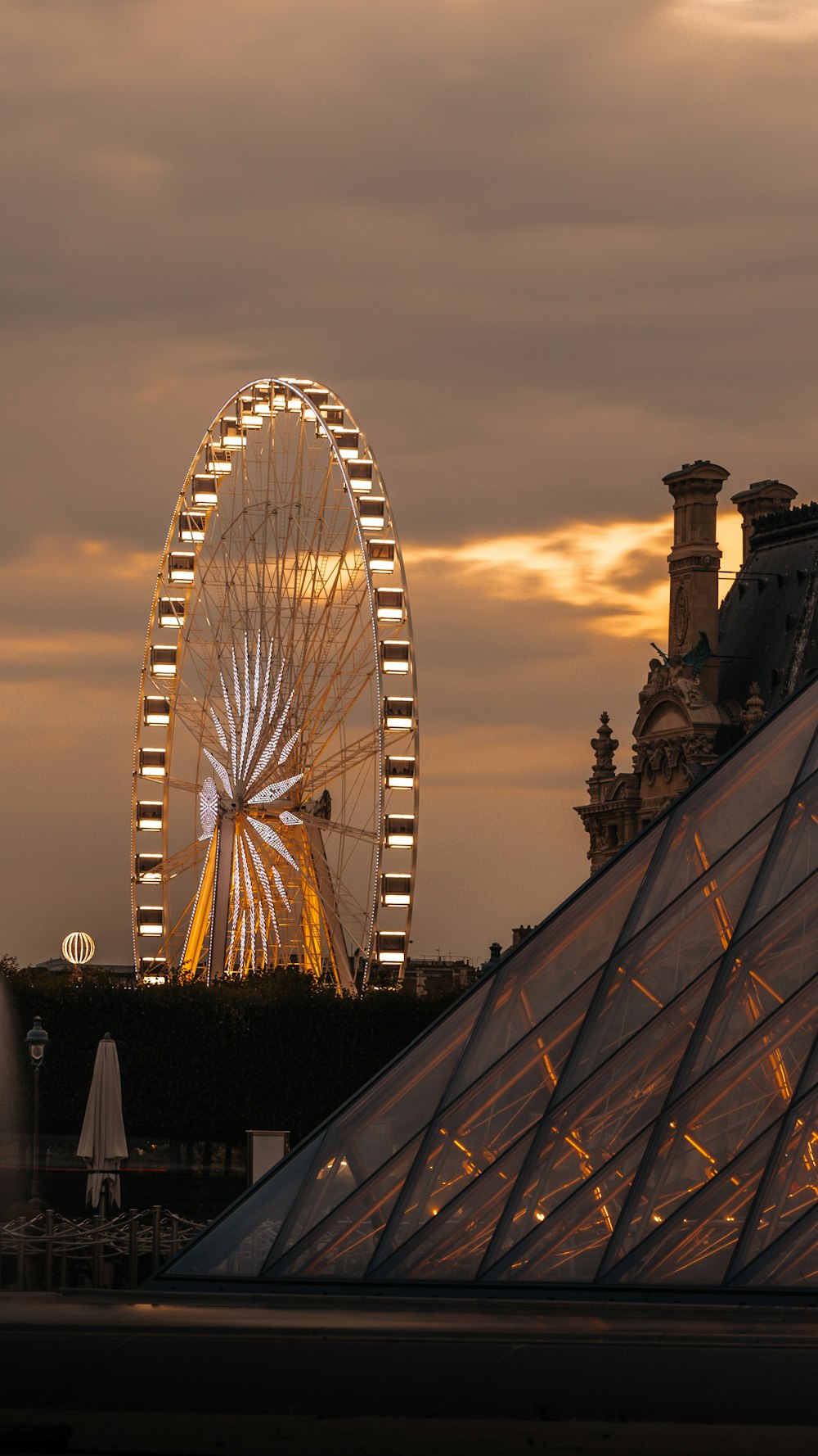 white ferris wheel under cloudy sky during daytime