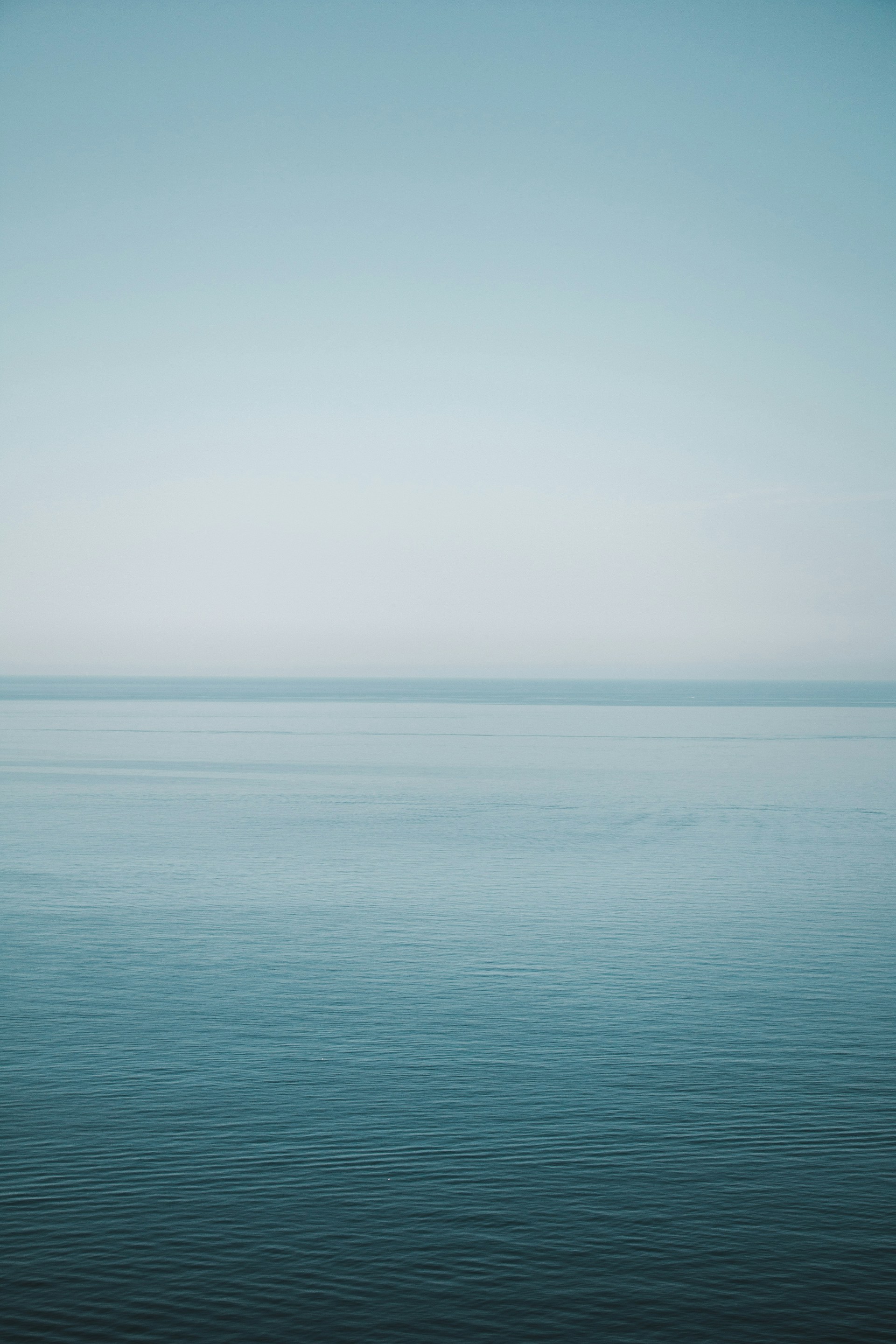 blue sea under white sky during daytime