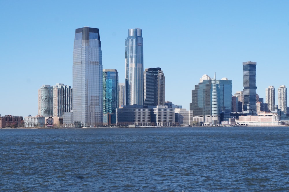 a large body of water with a city in the background