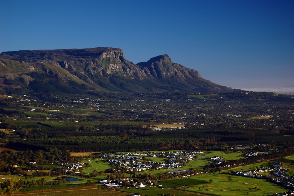 green and brown mountain under blue sky during daytime