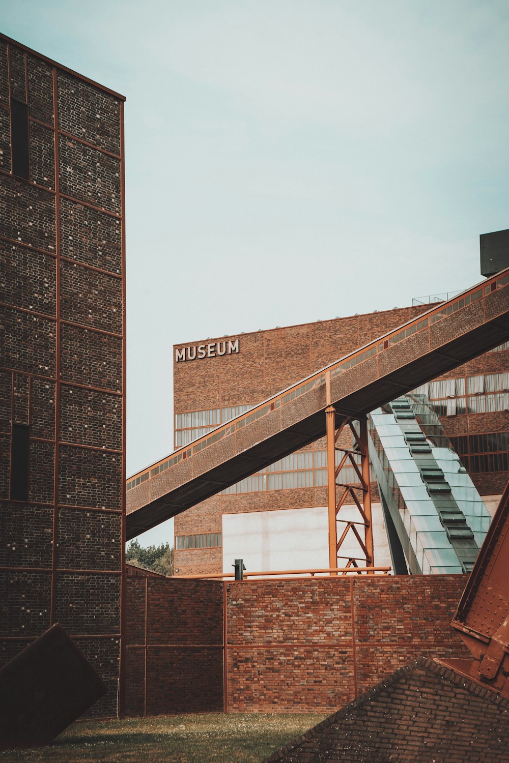 brown brick building under white sky during daytime