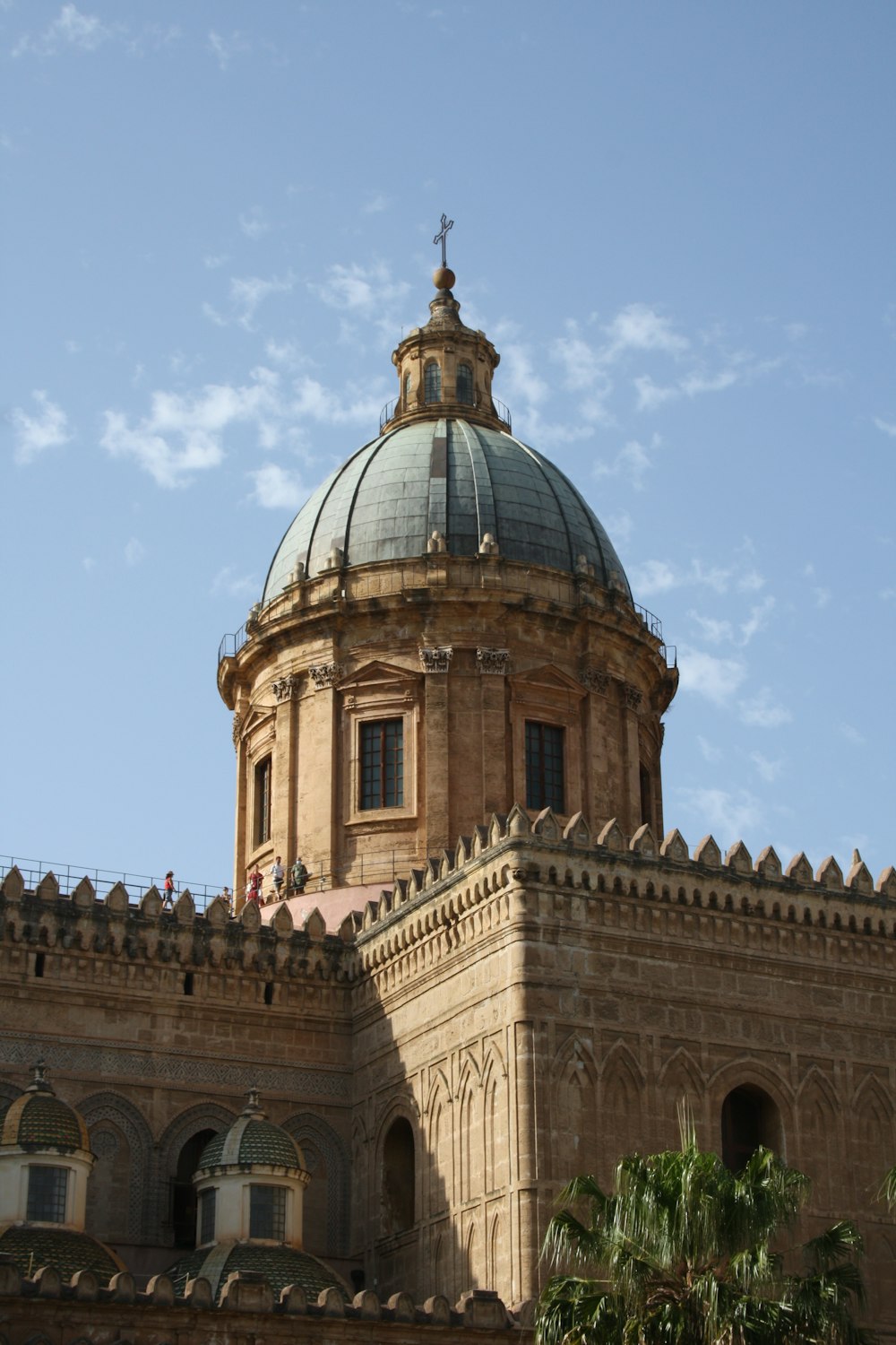 brown concrete building under blue sky during daytime