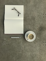 white ceramic mug on white ceramic saucer