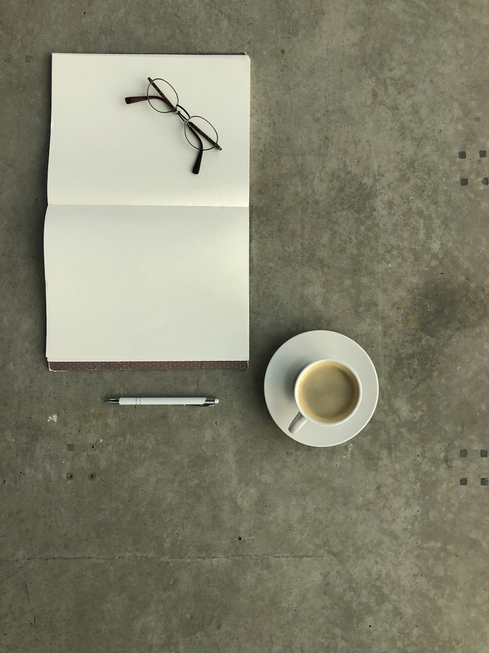 white ceramic mug on white ceramic saucer