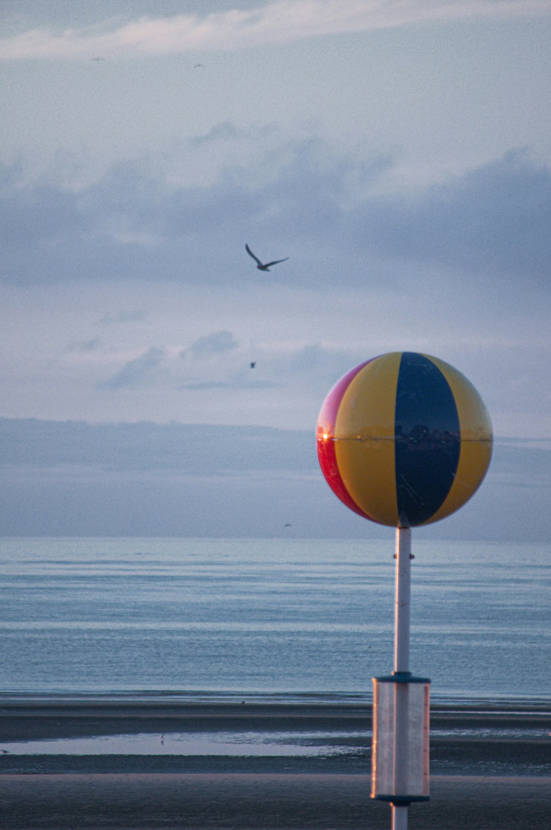 blue yellow and red balloon floating on water during daytime
