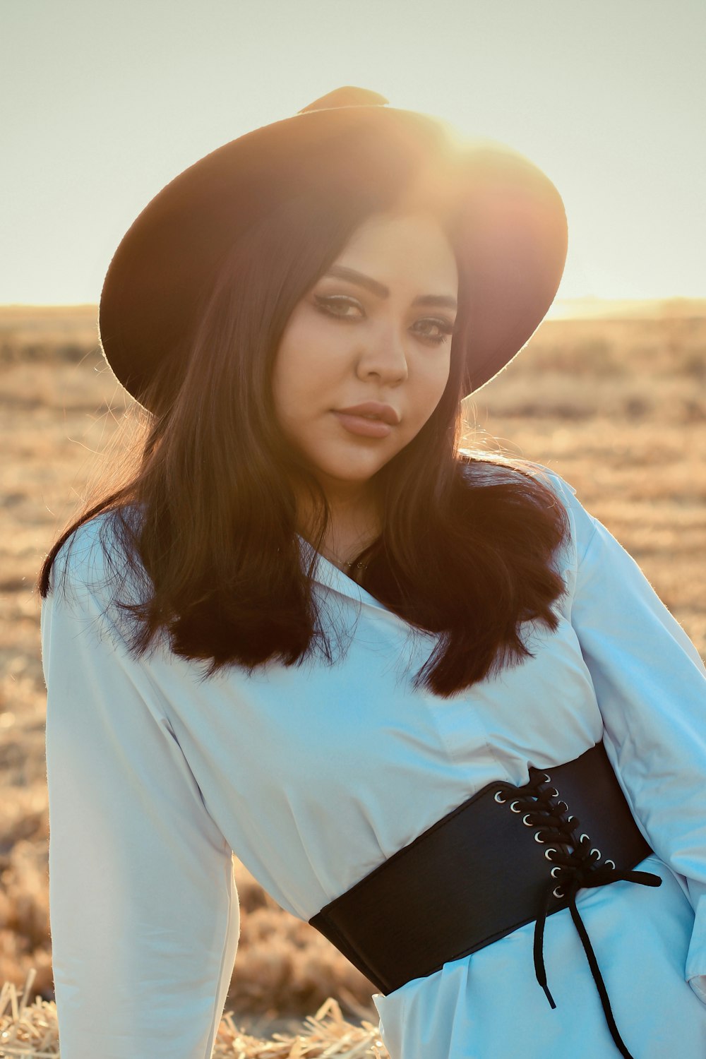 woman in white and black long sleeve shirt wearing black and white hat