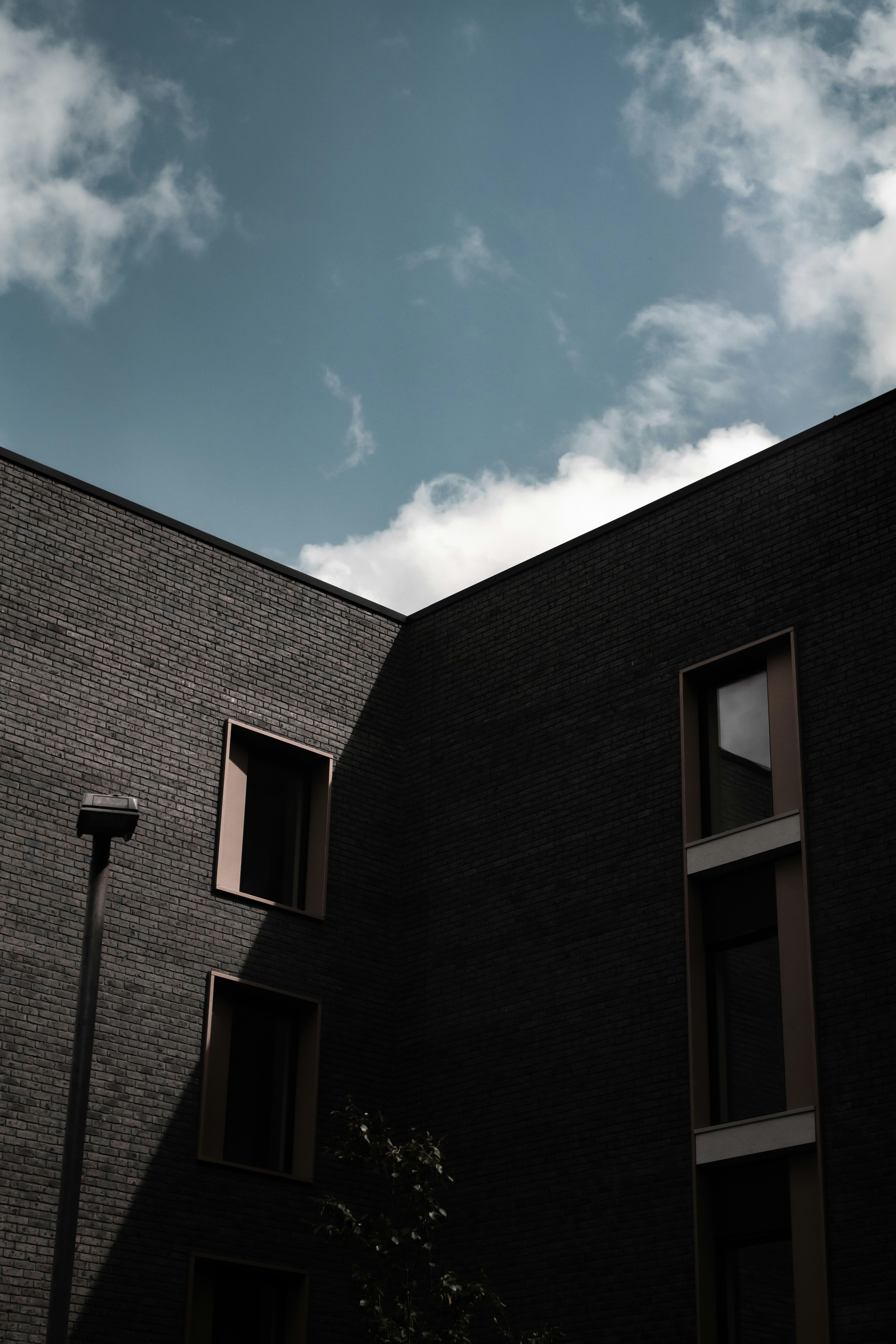 brown concrete building under blue sky during daytime