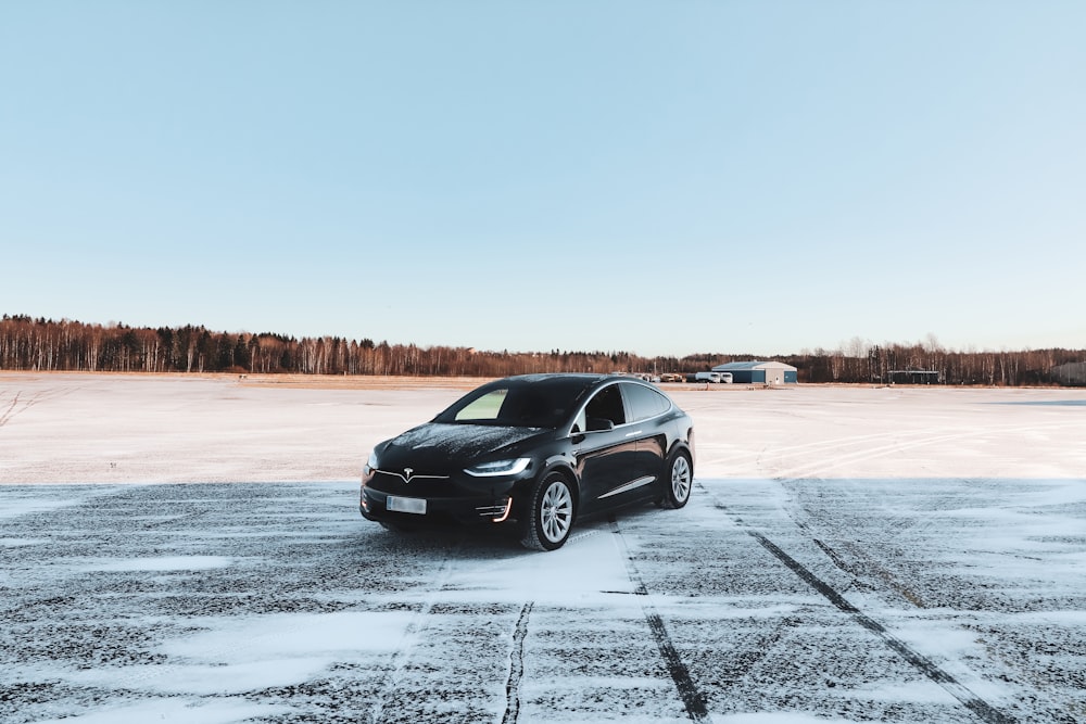 black honda sedan on snow covered ground during daytime