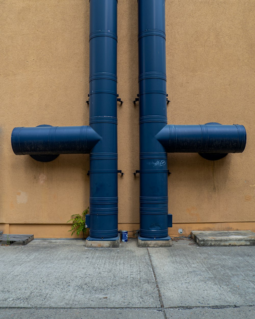 blue rolled textile on brown concrete wall