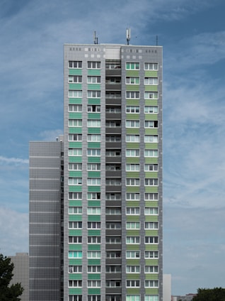 white and blue concrete building under blue sky during daytime