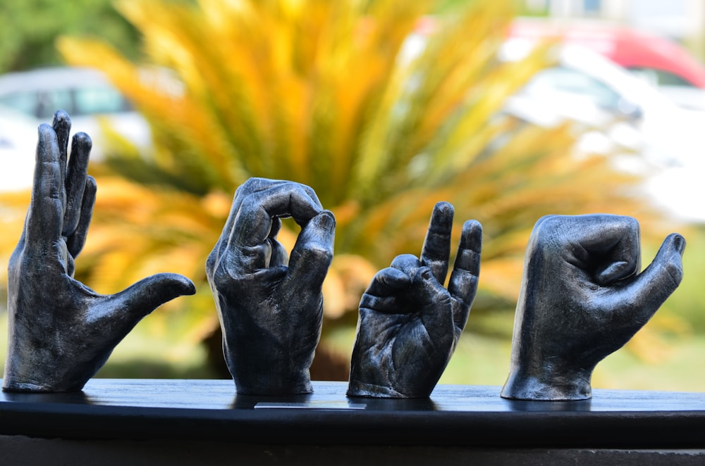 two black ceramic statue on black table