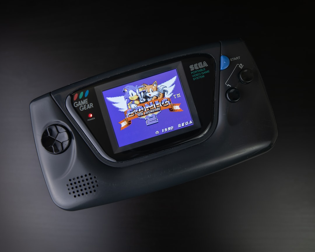black sony digital device on black surface, My upgraded Sega Game Gear with new screen installed.
