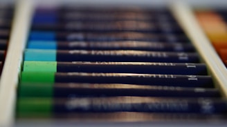 A colorful sketchnoting box with pencils, markers, and sketchpads arranged neatly.