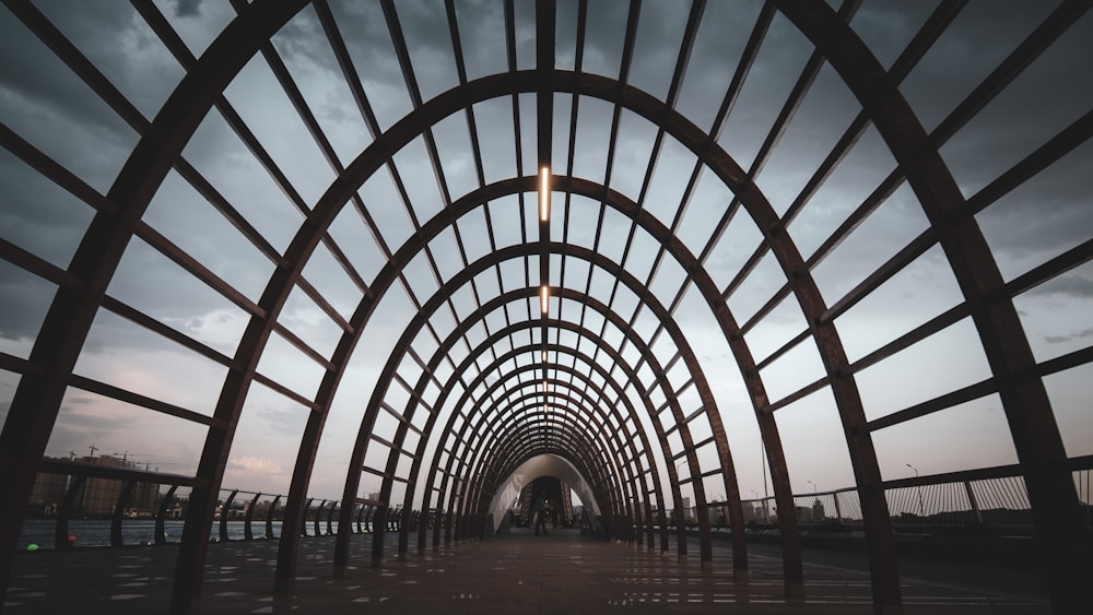 people walking on a tunnel