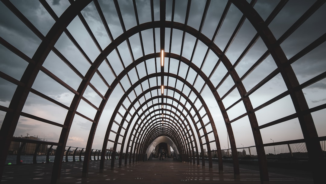 people walking on a tunnel,