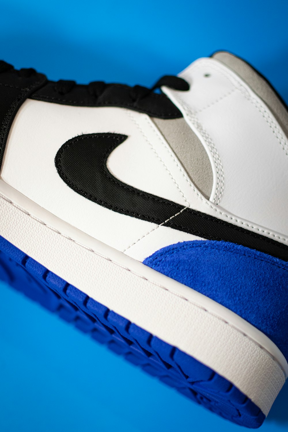 blue white and black nike shoe