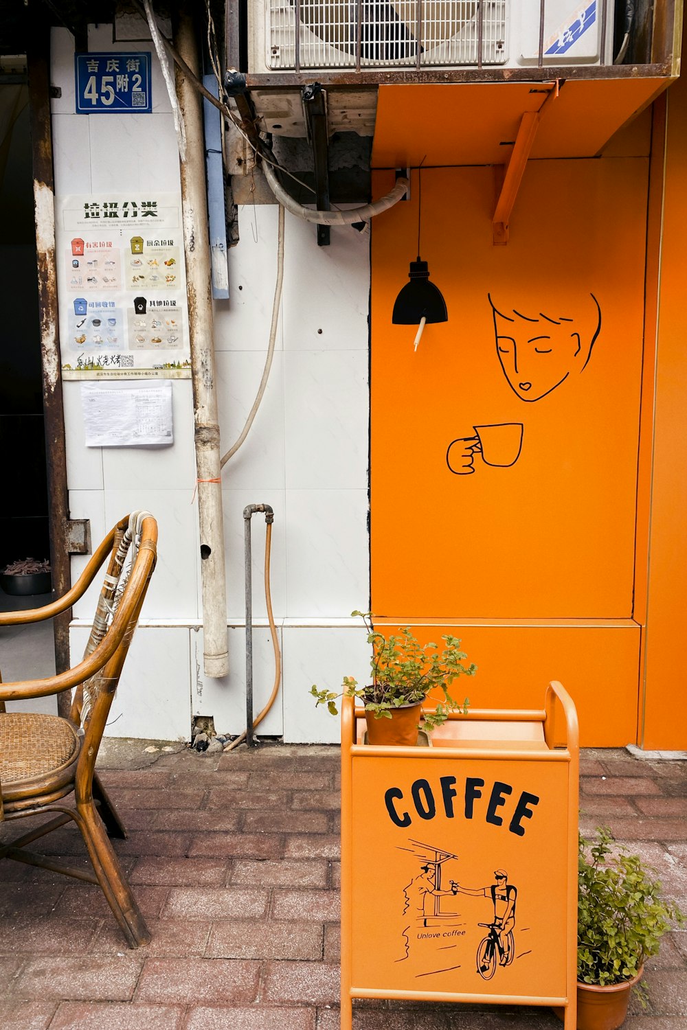 brown wooden chair beside orange wall