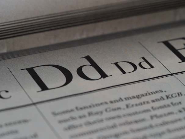 Close-up shot of a textured page from a Novacula editorial project showing intricate typography details