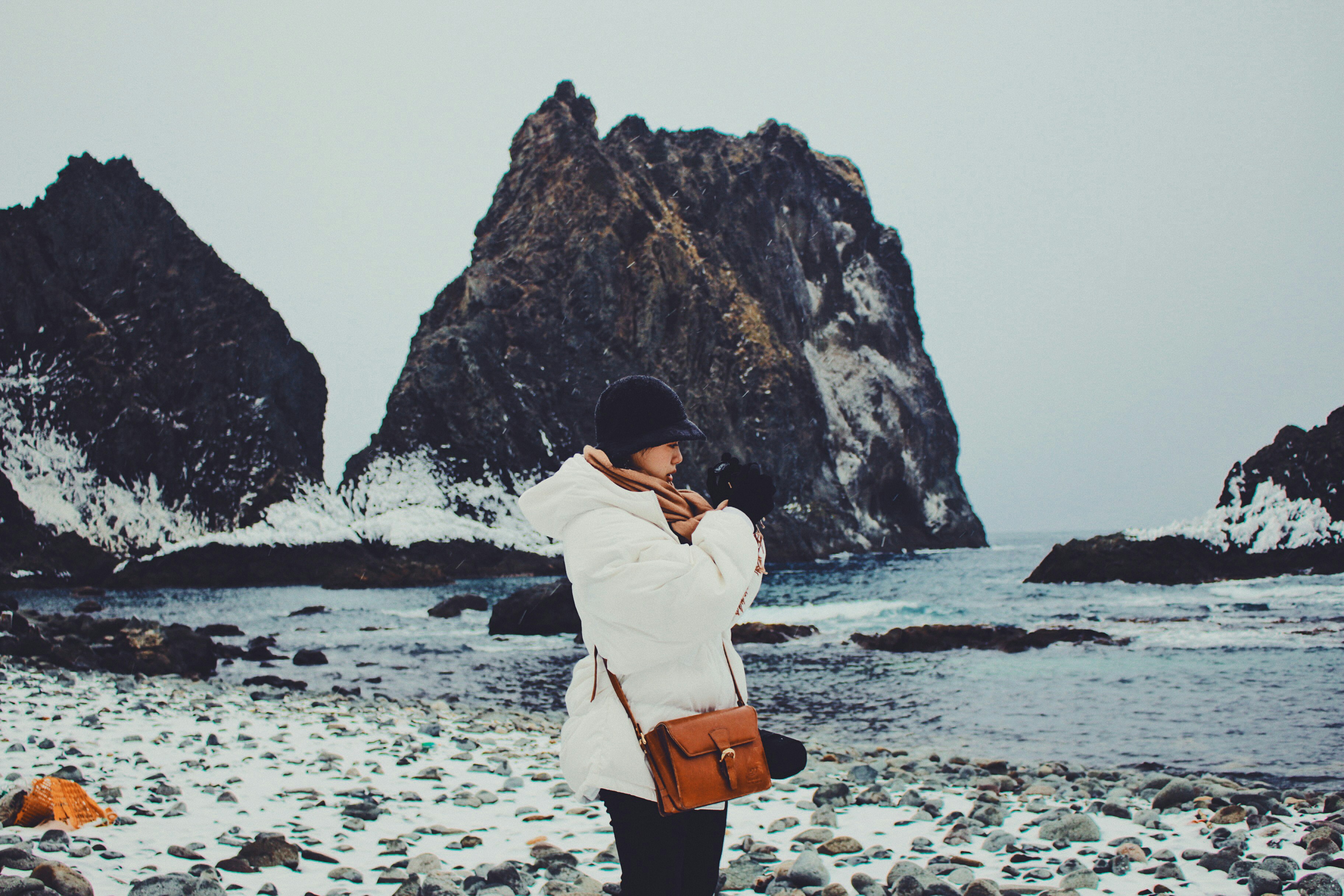 Woman In White Long Sleeve Shirt And Black Skirt Standing On Seashore During Daytime Photo Free 日本北海道積丹町 Irikacho Image On Unsplash