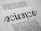 A close-up view of a typography artwork featuring the word 'science' in a stylized, script-like black font against a white background. Below it, there is a quote about science written in a smaller, sans-serif font. Above the main word, there is another sentence printed upside-down.