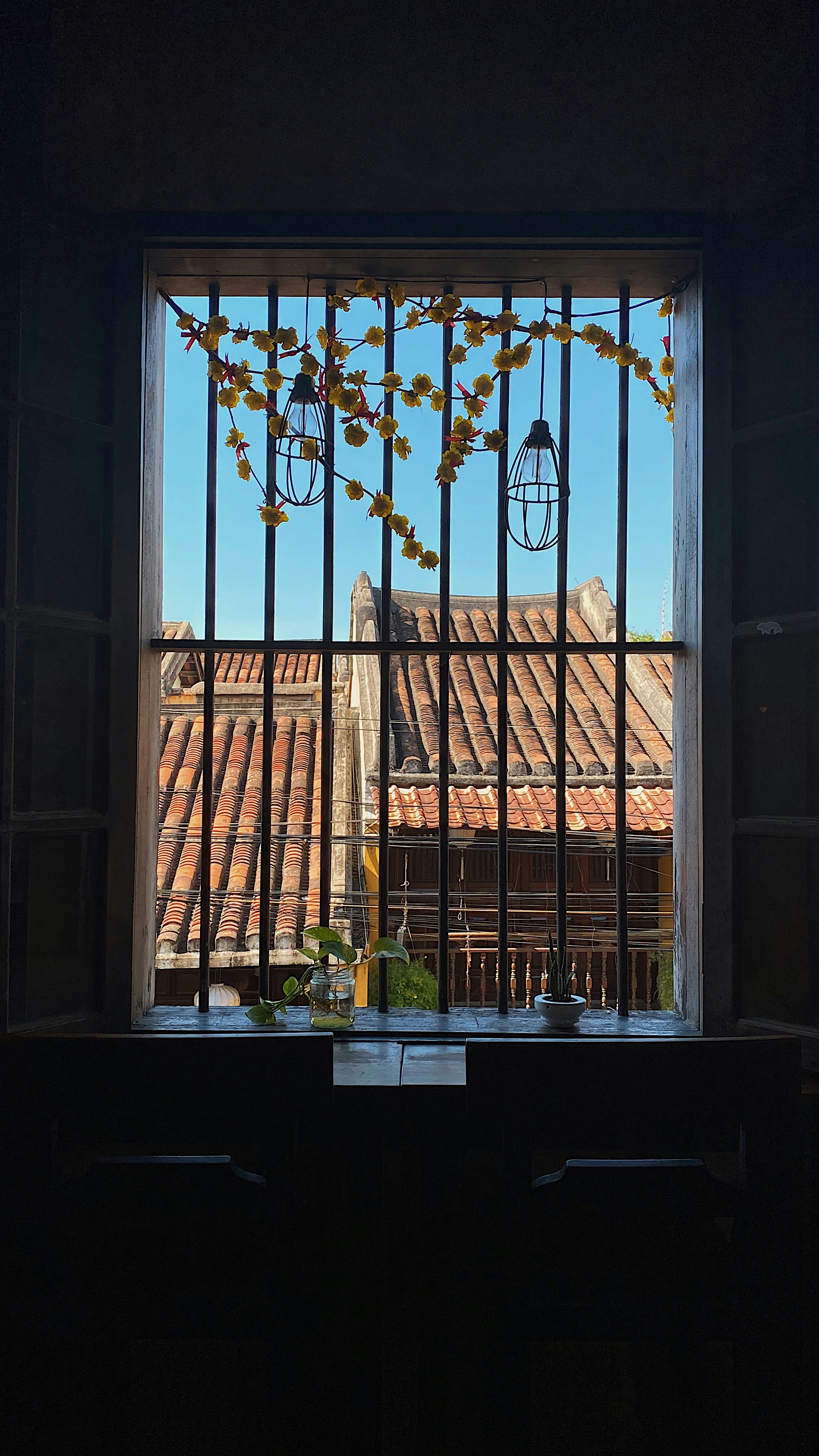 brown wooden window frame with brown leaves