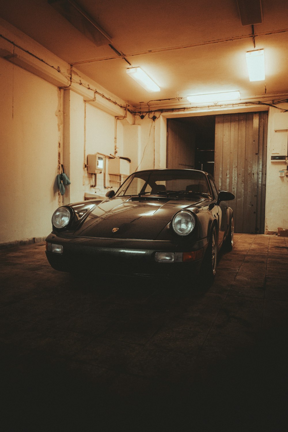 Black Porsche 911 Parked In Garage Photo Free Car Image On Unsplash