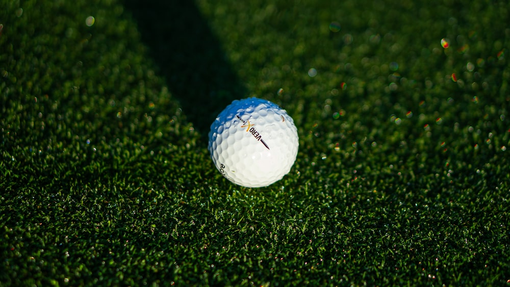 white golf ball on green grass field