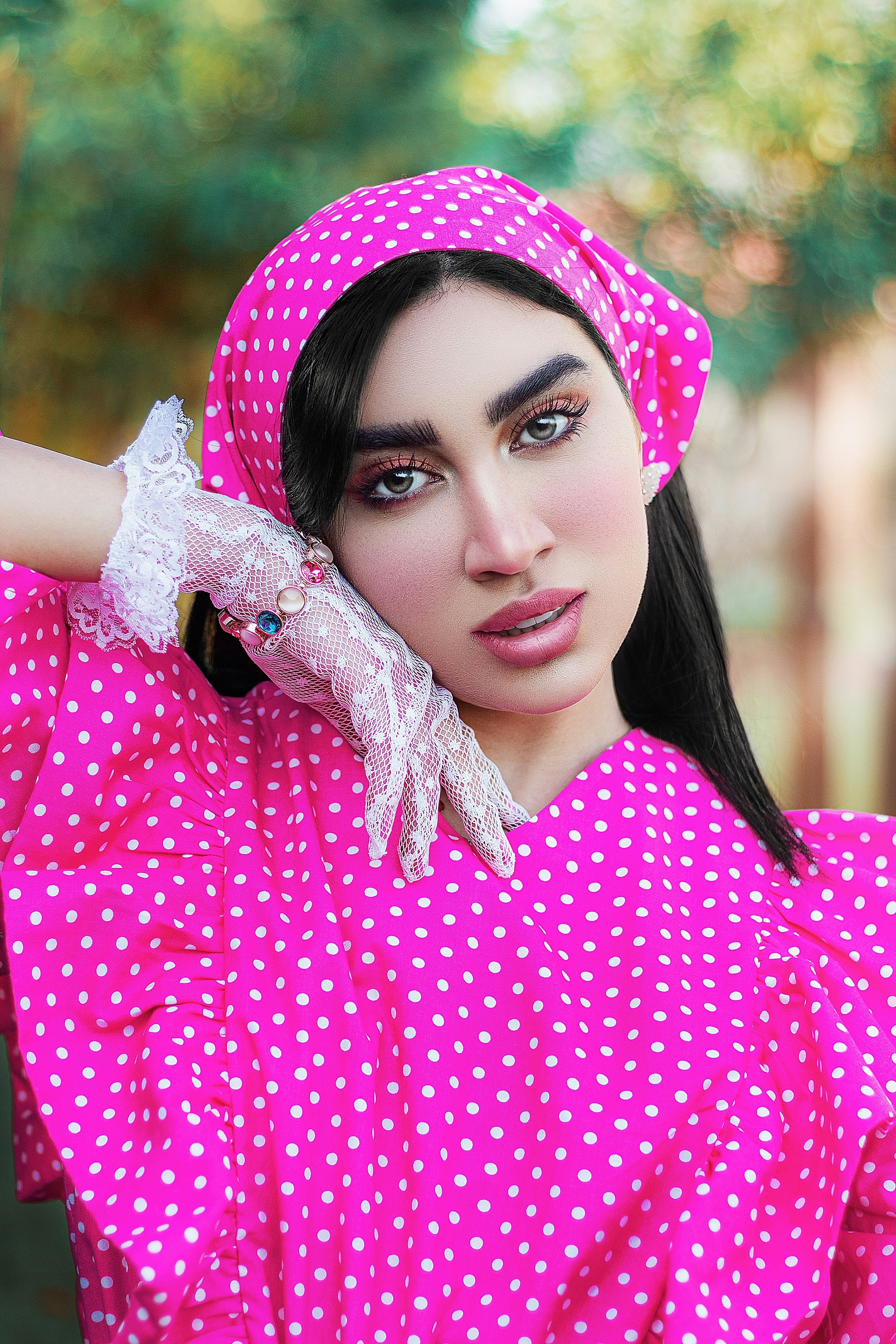 woman in pink and white polka dot hijab