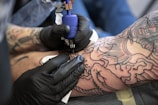 person with tattoo on right arm