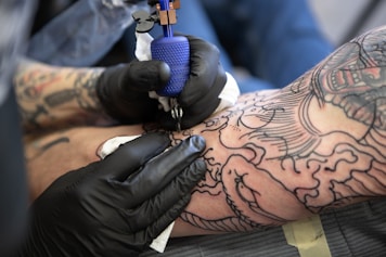 person with tattoo on right arm