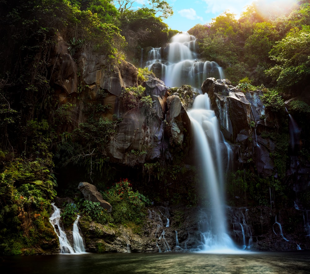 waterfalls in the middle of the forest