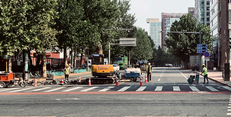 Engineers inspecting smart urban traffic management devices on site.